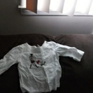 White long sleeve shirt with woman walking dog on